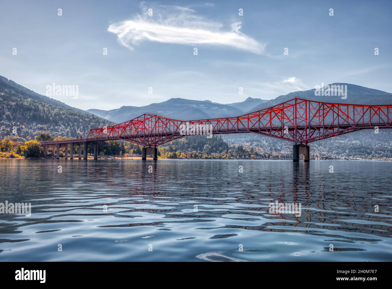 Big Orange Bridge over Kootenay River with Touristic Town Stock Photo