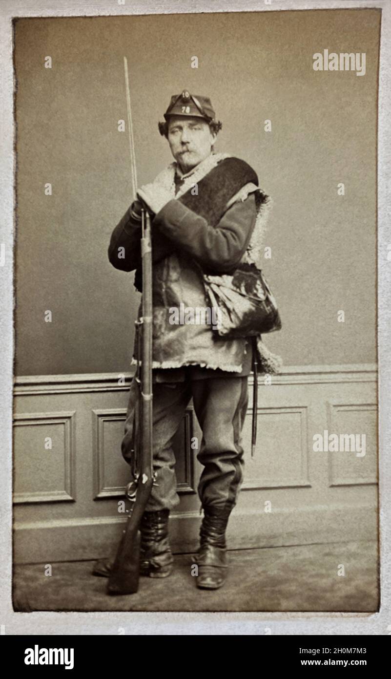 1870 , PARIS , FRANCE : The  french  painter Louis Valentin EMILE De LATREMBLAIS ( de La Tremblais , 1821 - 1892 ), in military uniform , with the rifle with the boionette , during the Franco-Prussian War . Photo by L. Daillon , Paris . - Émile de La Tramblais - Guerra franco-prussiana - SECONDO IMPERO - ARTS - ARTE - PITTURA - painting - PITTORE - artist - artista - portrait - ritratto - barba - beard - vestito  uniforme divisa militare - fucile con baionetta - gun -- boots - stivali - HISTORY - FOTO STORICHE - PORTRAIT - RITRATTO --- ARCHIVIO GBB Stock Photo