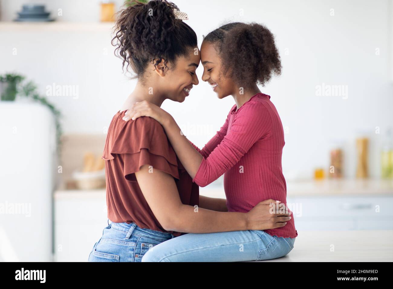 Mother And Daughter Hugging Profile High Resolution Stock Photography mother-and-daughter-hugging-profile-high-resolution-stock-photography