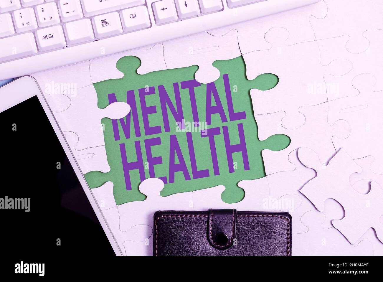 Text caption presenting Mental Health. Word Written on persons condition regard to their psychological well being Building An Unfinished White Jigsaw Stock Photo