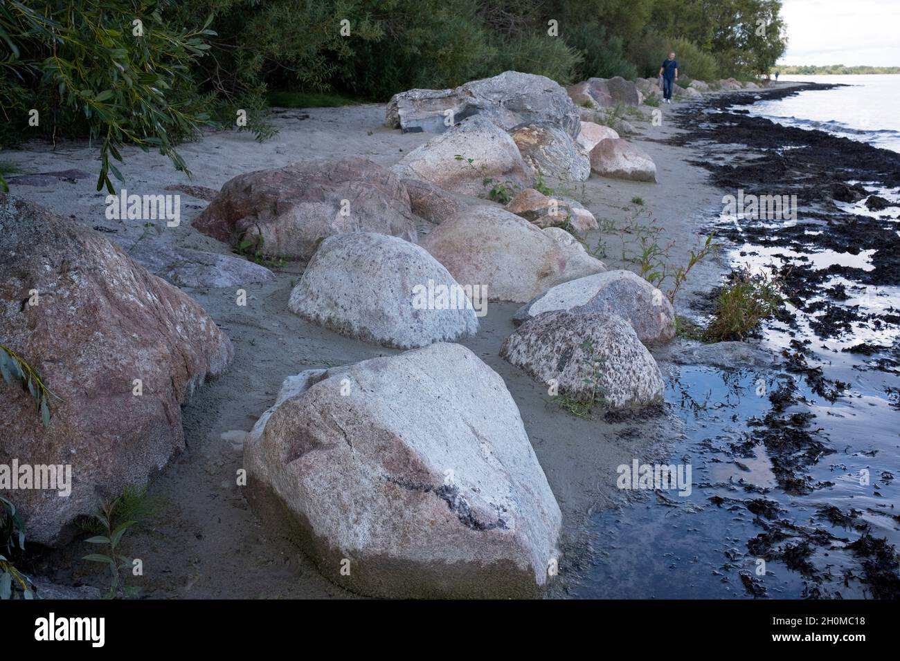 Waterfront Rocks Seaside rocks and narrow sandy waterfront for leisure walk and peaceful ...