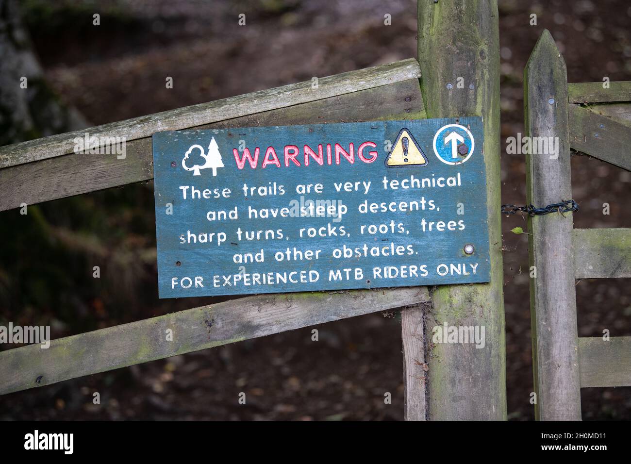 Mountain bike trail warning sign on downhill track Innerleithen, Tweed Valley, Scotland, UK 'for experienced mtb riders only' Stock Photo