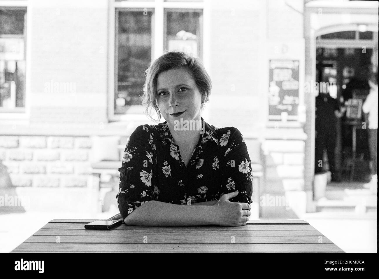 Tilburg, Netherlands. Portrait of a adult, caucasian, blonde woman strolling through down town neigborhoods. Stock Photo