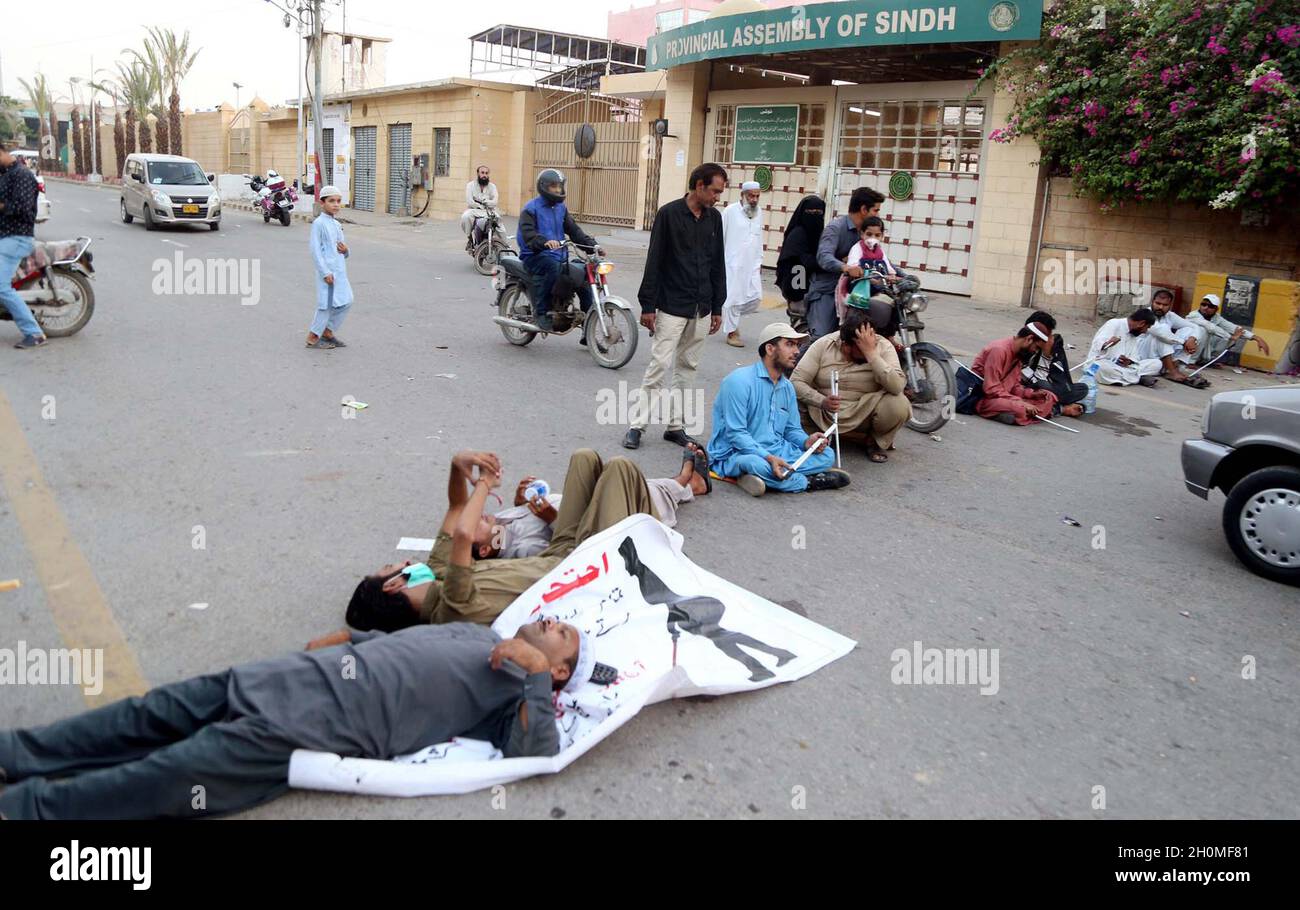 Disable blind persons block road as they are holding protest demonstration against unemployment and price hiking, outside Sindh Assembly building in Karachi on Wednesday, October 13, 2021. Stock Photo