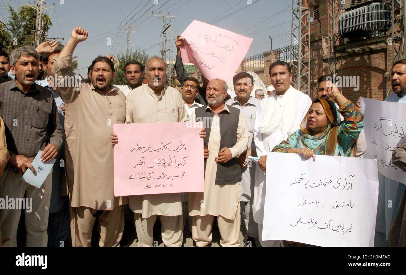 Members of Khyber Union of Journalists are holding protest demonstration against high handedness of police department, at Peshawar press club on Wednesday, October 13, 2021. Stock Photo