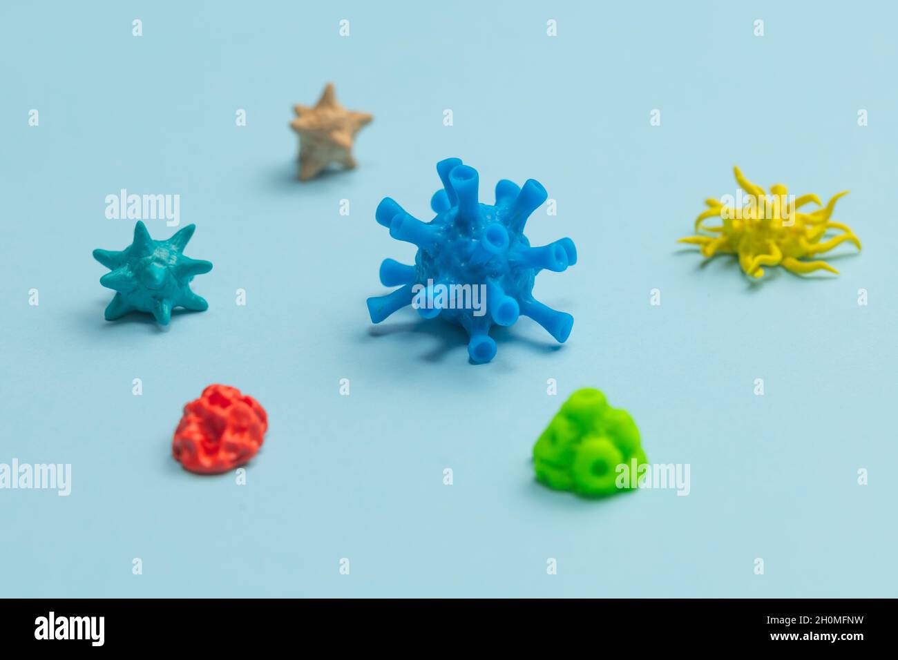 Different viruses and bacteria on a blue background. Stock Photo