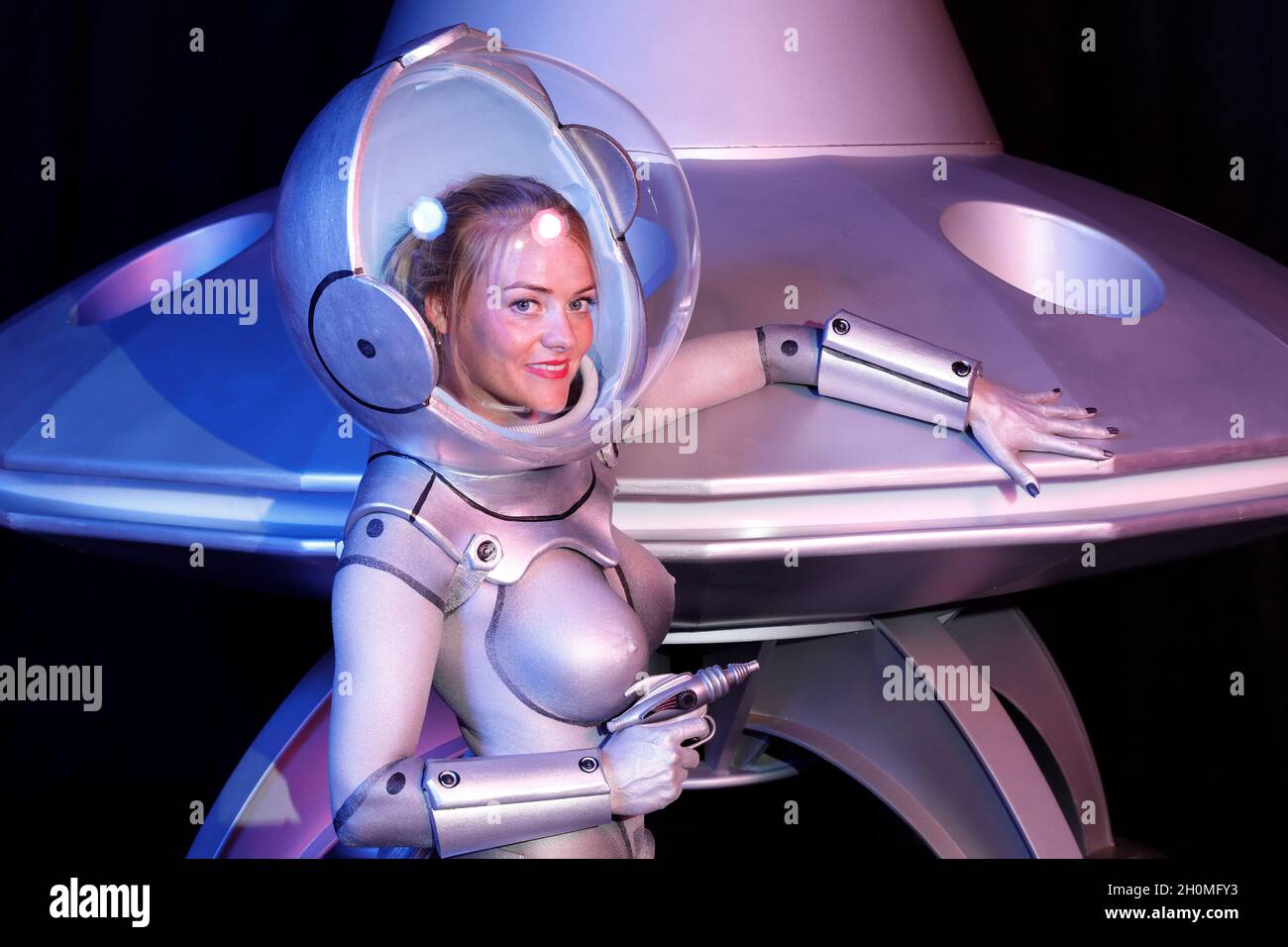 GEEK ART - Bodypainting and Transformaking: UFO photoshooting with Daniela Buchholz as a space girl with an UFO at the Filmwelt Center in Bad Muender on October 13, 2021 - A project by the photographer Tschiponnique Skupin and the bodypainter Enrico Lein Stock Photo