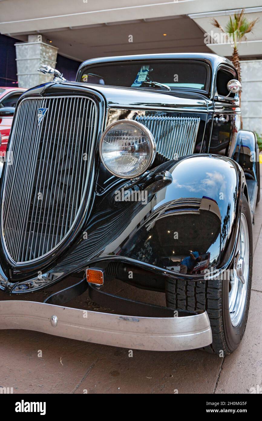 Restored black collectable car from the 30s with a greyhound hood ornament Stock Photo