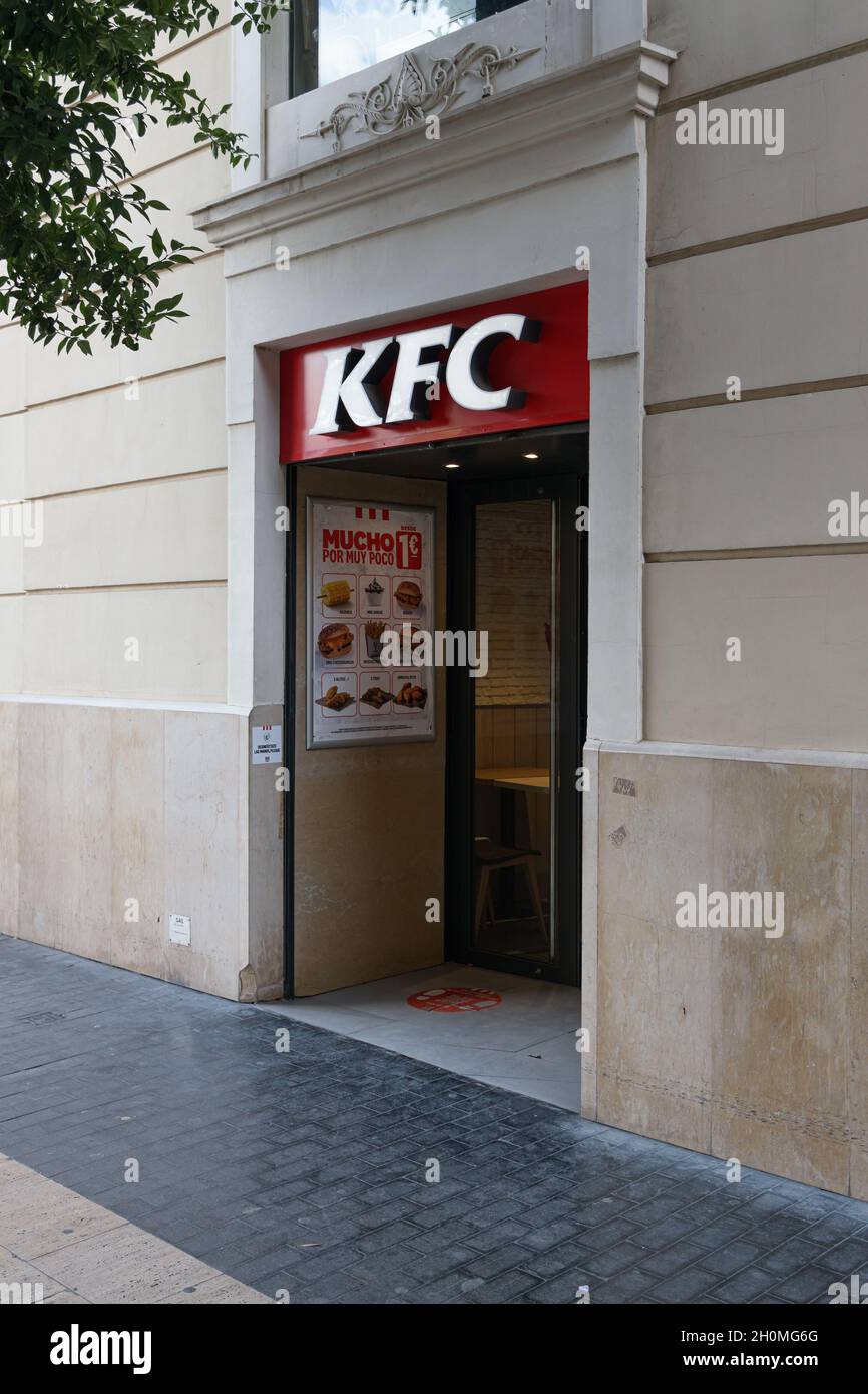 VALENCIA, SPAIN - SEPTEMBER 21, 2021: KFC is an American fast food restaurant chain that specializes in fried chicken Stock Photo