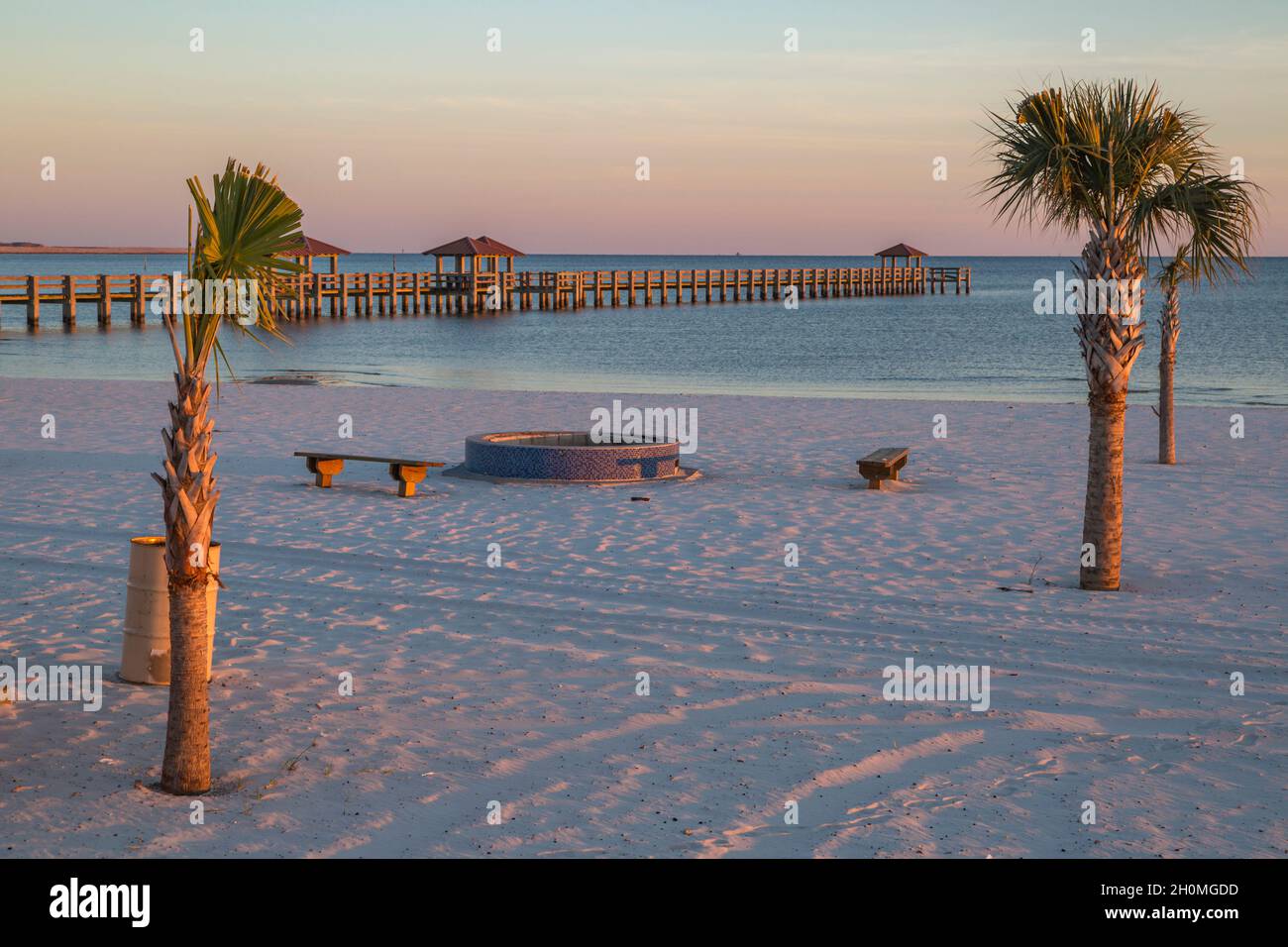 West Side Pier fishing pier behind public fire pit along the Mississippi Gulf Coast in Gulfport Stock Photo
