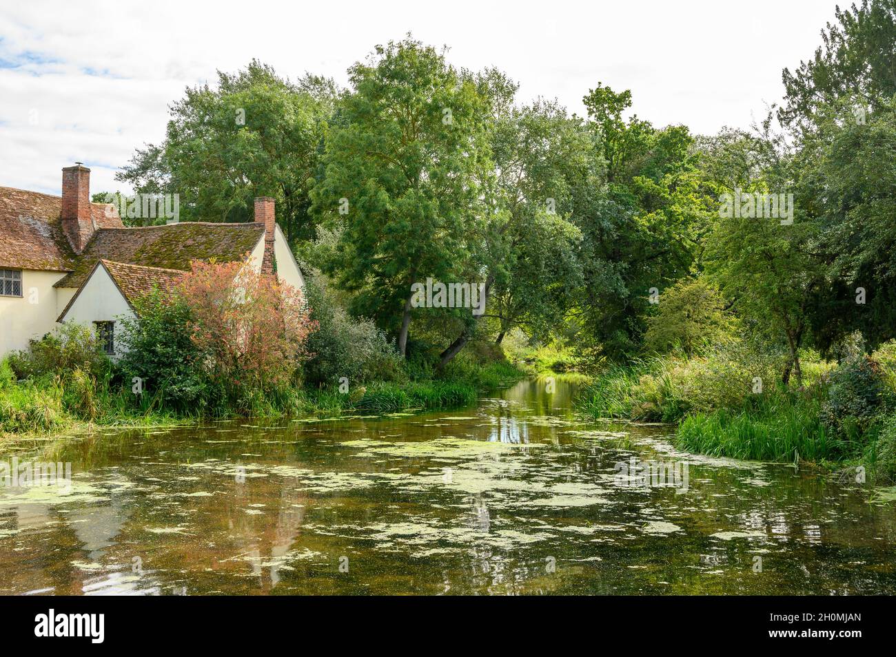 Willy Lott's House and river Stour seen from Flatford Mill, Suffolk, England. Stock Photo