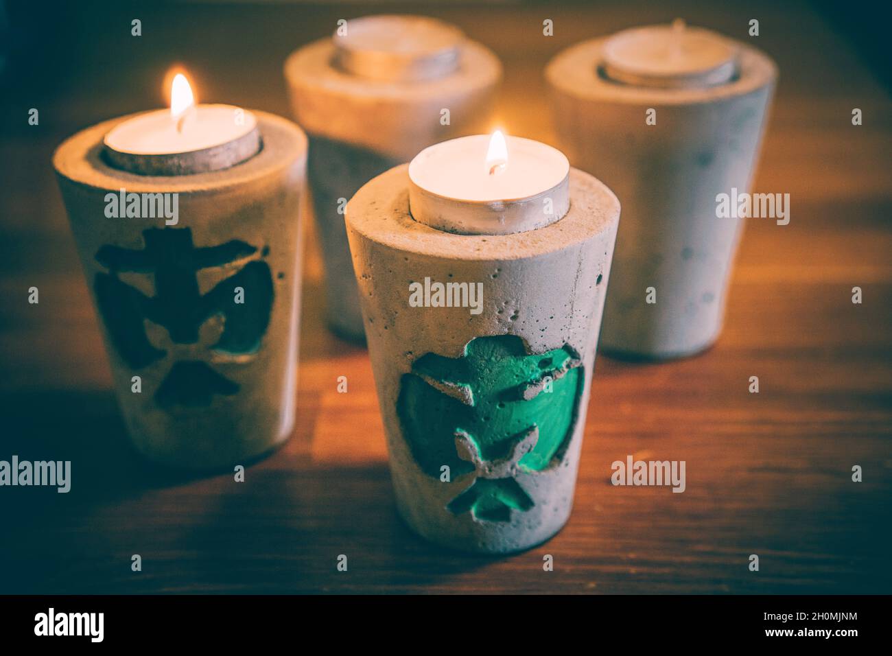 BERLIN, GERMANY Mar 03, 2021 Burning candles in a concrete