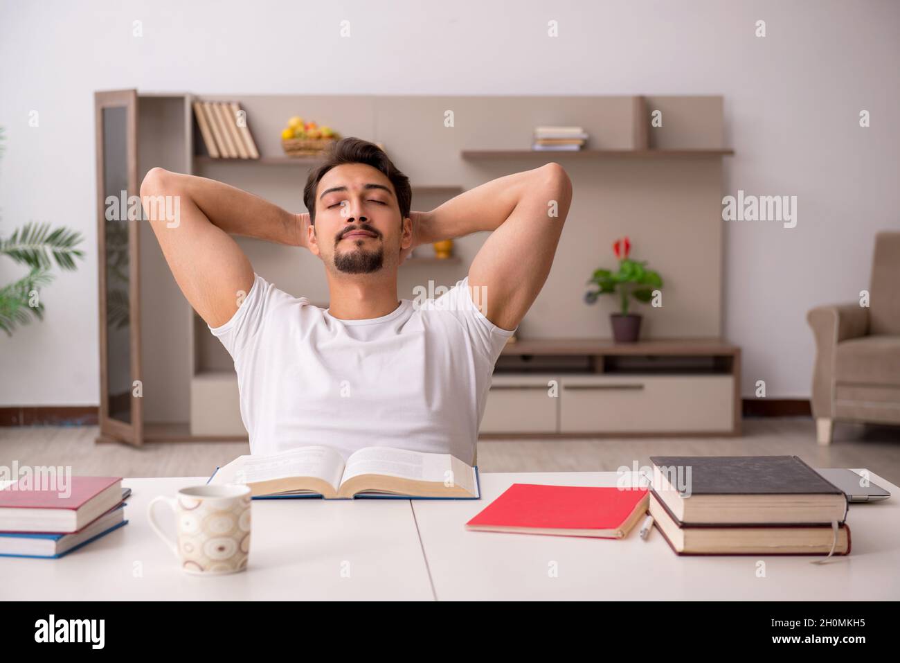 Young student studying at home during pandemic Stock Photo - Alamy