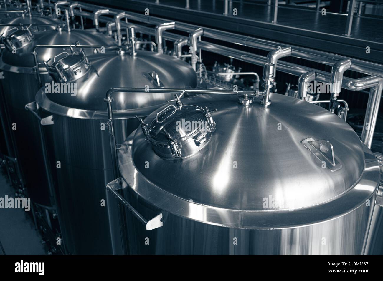 Modern brewery production steel tanks and pipes, machinery tools and vats,  beer production Stock Photo - Alamy