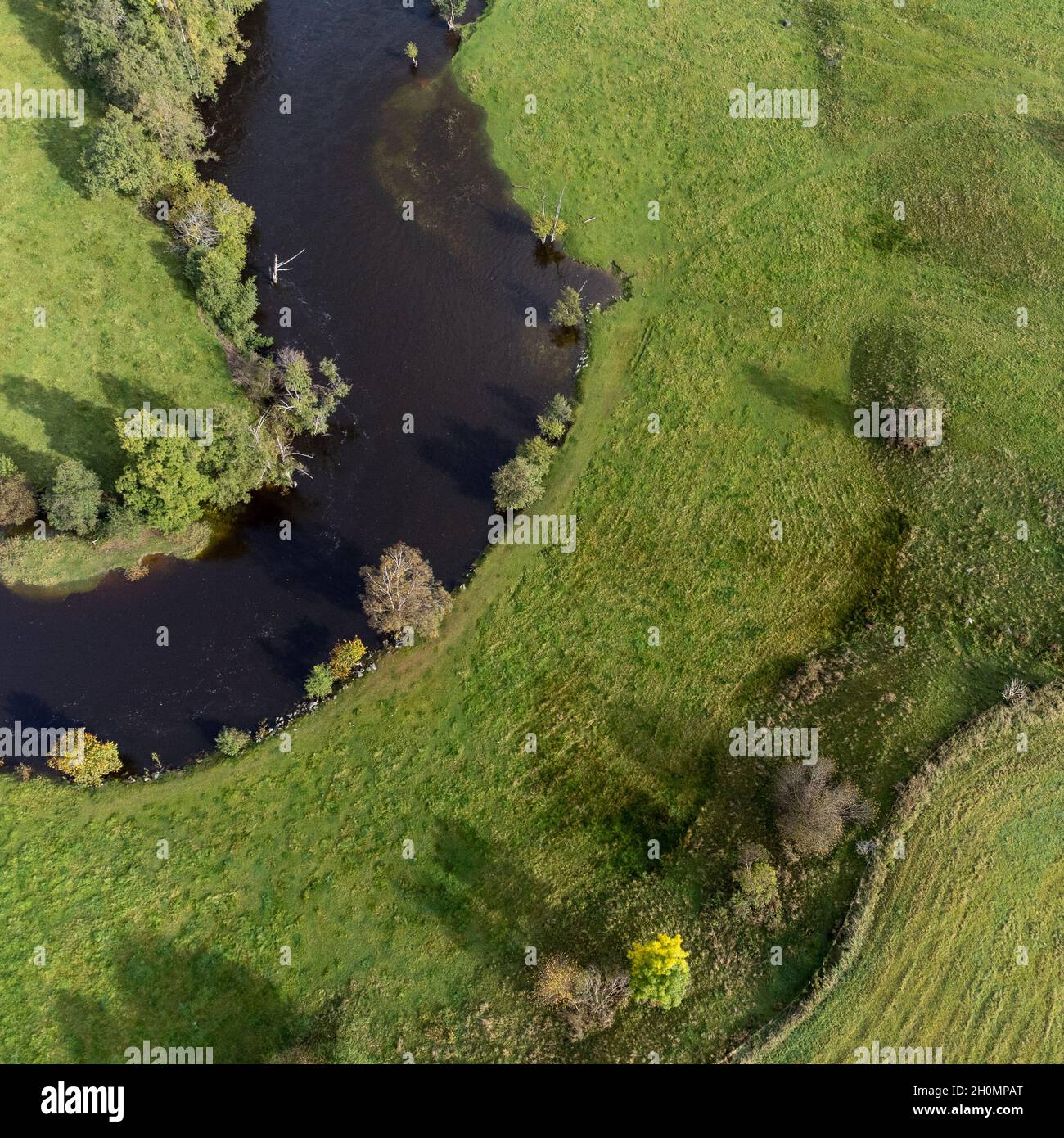 Aerial view of nature landscape with river and green fields Stock Photo ...