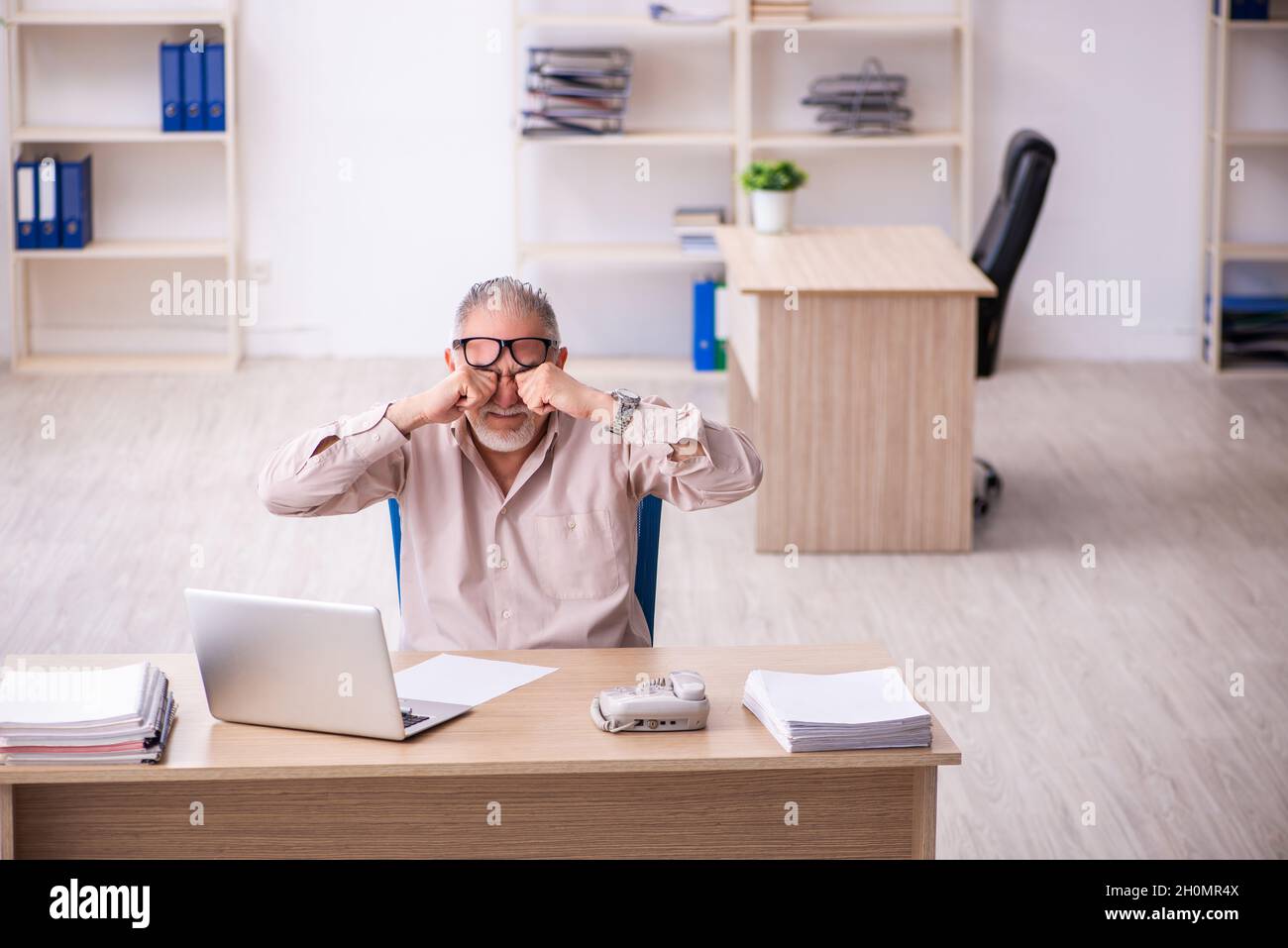 Old businessman employee working at workplace Stock Photo - Alamy