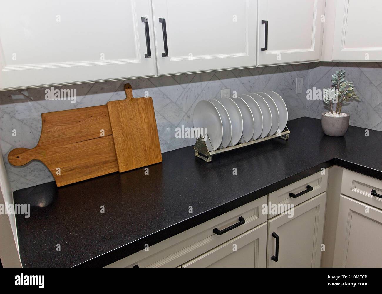 Kitchen Counter With Plates, Plate Rack And Cutting Boards Stock Photo