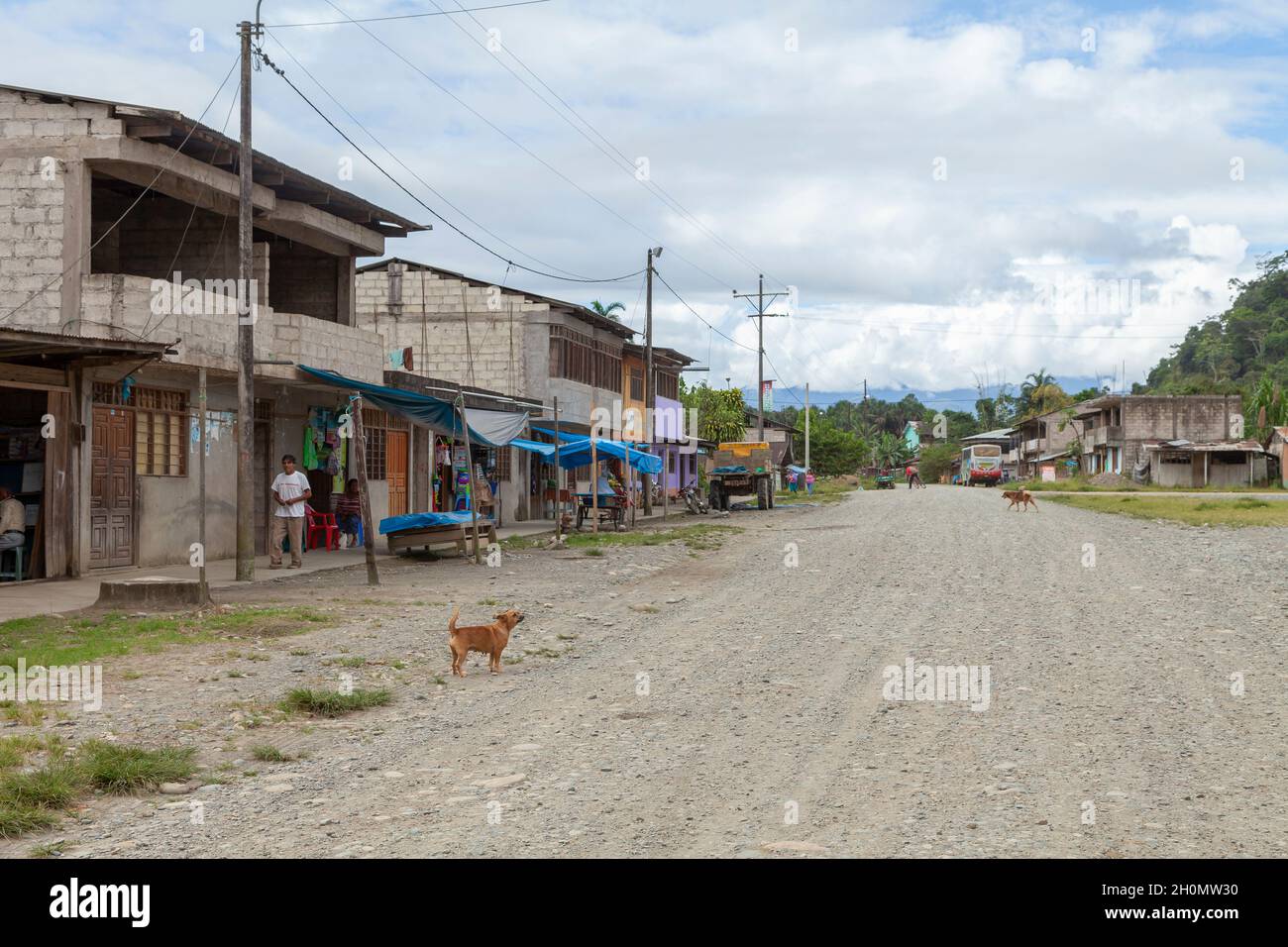 Pilcopata, Peru - April 10, 2014: Several houses in one of the neighborhoods of the small town of Pilcopata, line a dirt street Stock Photo
