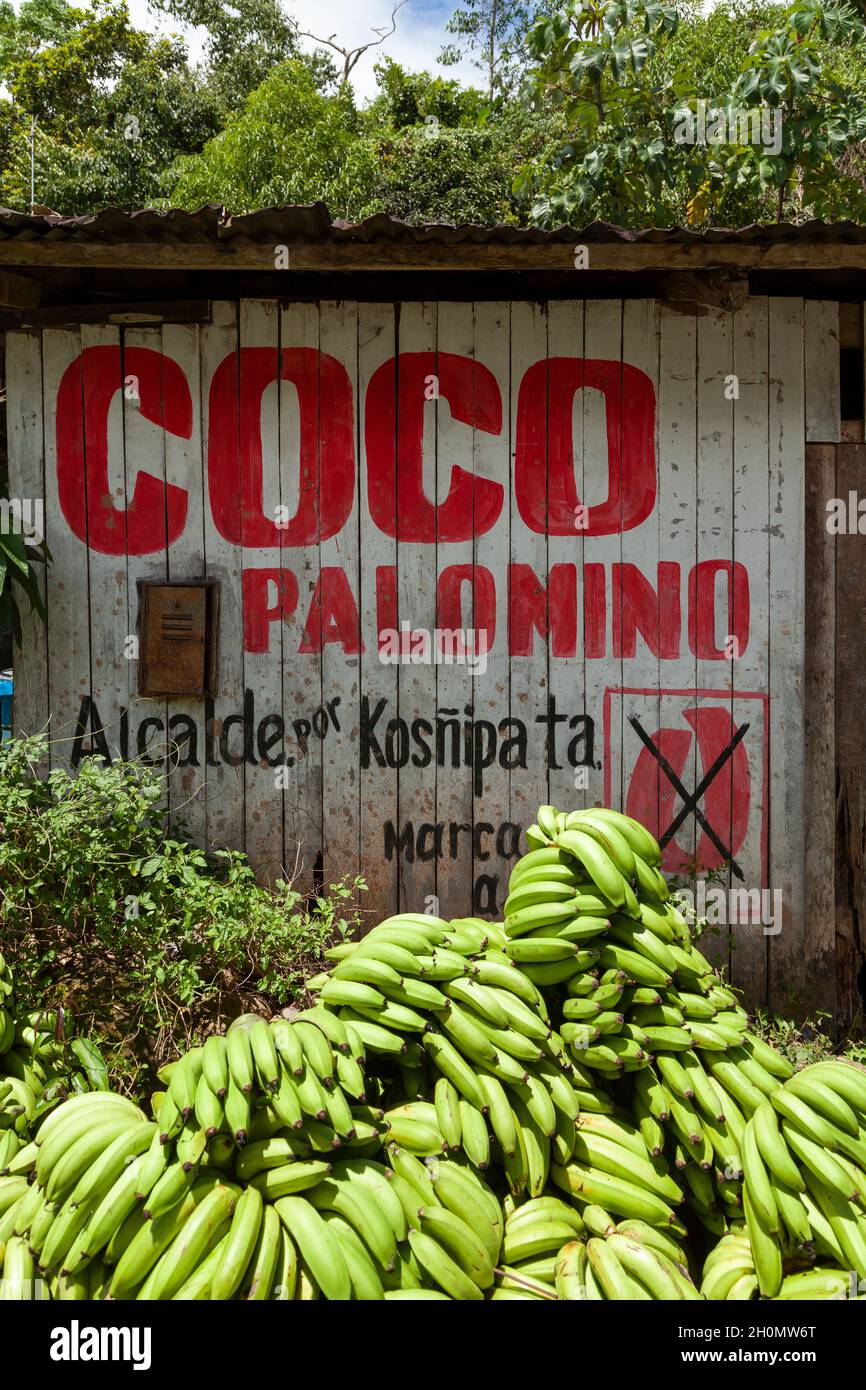 Pilcopata, Peru - April 10, 2014: Election advertising of some political party, painted on a wooden hut, in Atalaya Kosñipata, near the river Stock Photo