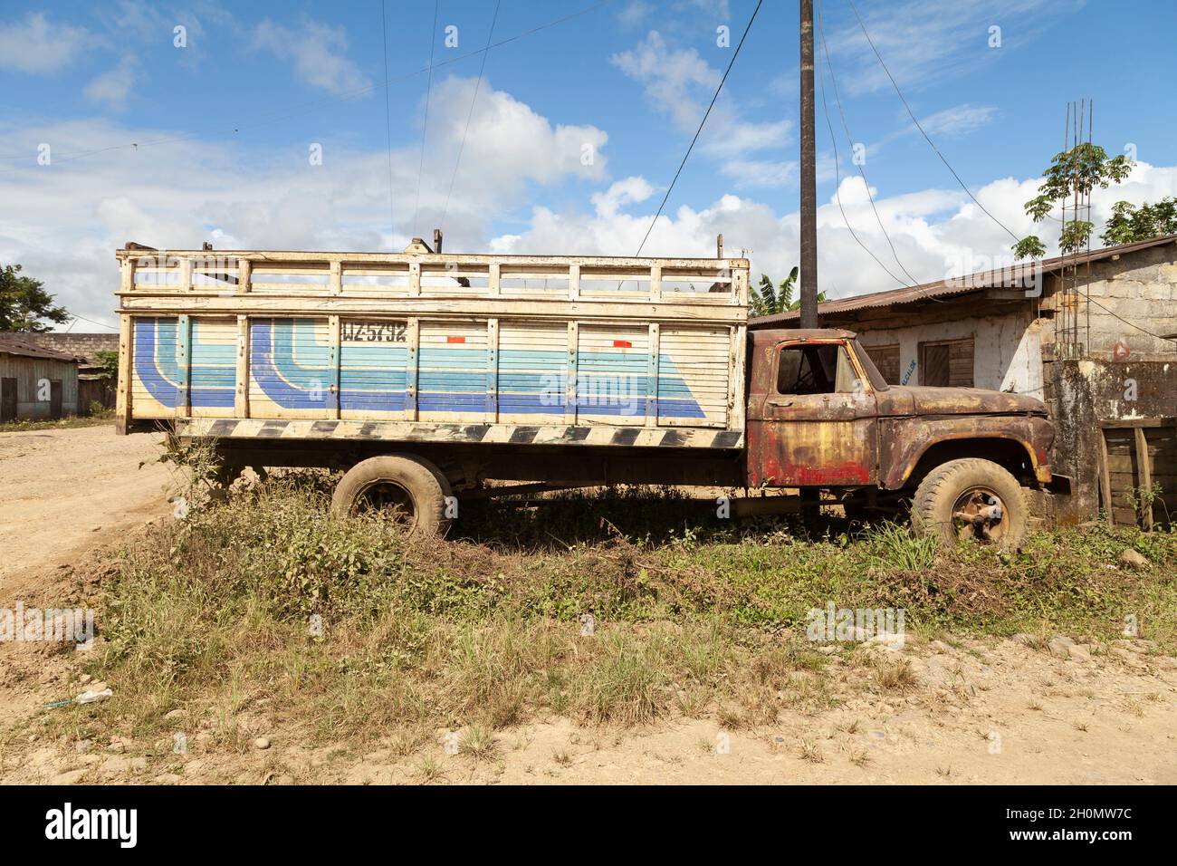 Pilcopata, Peru - April 12, 2014: An old, rusty and abandoned big truck, with veiled crystals, rests in the surroundings of the small town of Pilcopat Stock Photo