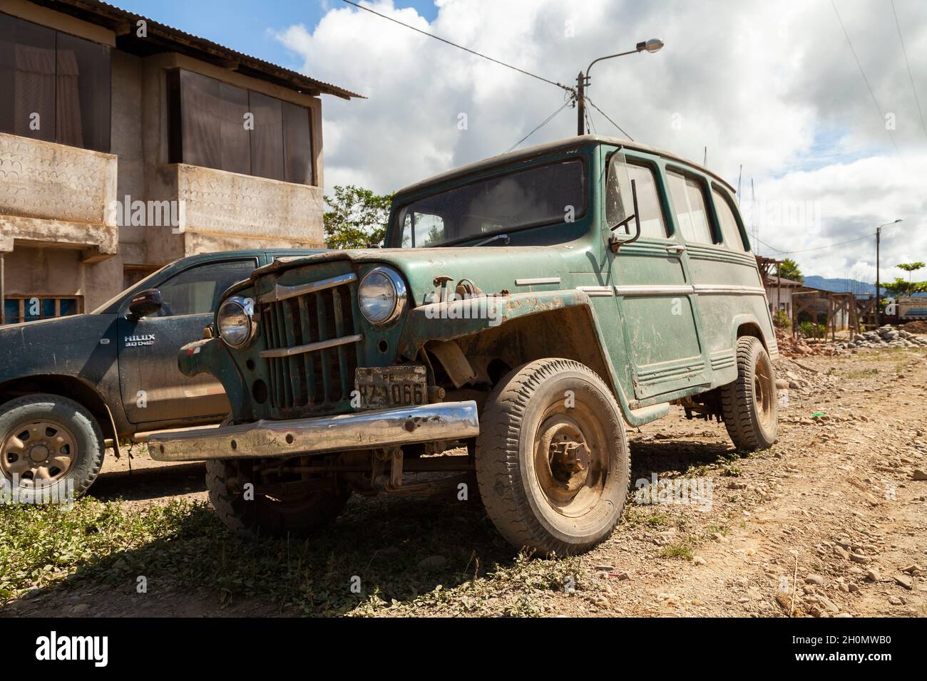 Pilcopata, Peru - April 12, 2014: An old off-road vehicle of green color, parked in one of the streets of the small town of Pilcopata Stock Photo