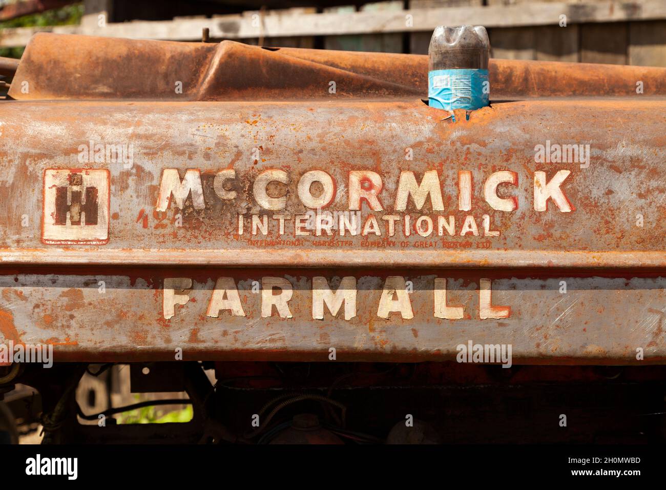 Pilcopata, Peru - April 12, 2014: Close-up of an old tractor, Mc Cormick International Farmall, totally rusted, Pilcopata Stock Photo