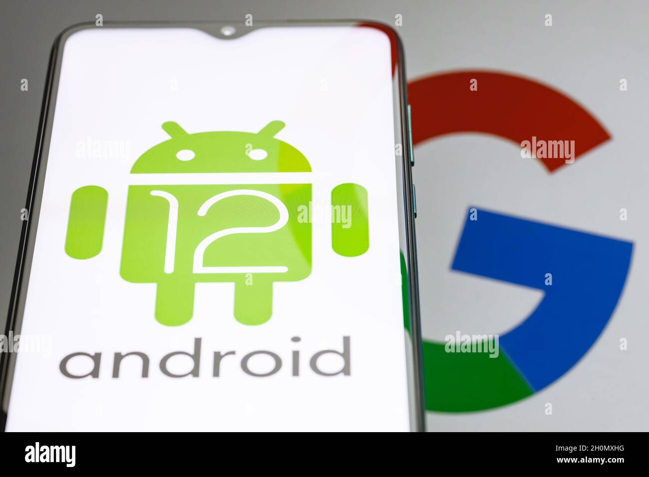 Android is a mobile operating system. The twelfth version of the Android operating system developed by Google. Android 12 logo on smartphone screen. Stock Photo