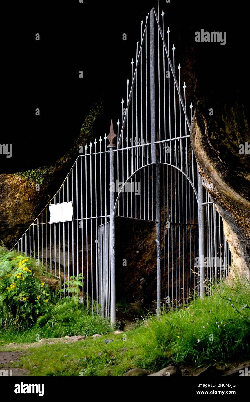Gated entrance to King's Cave, Blackwaterfoot, Isle of Arran, Scotland Stock Photo