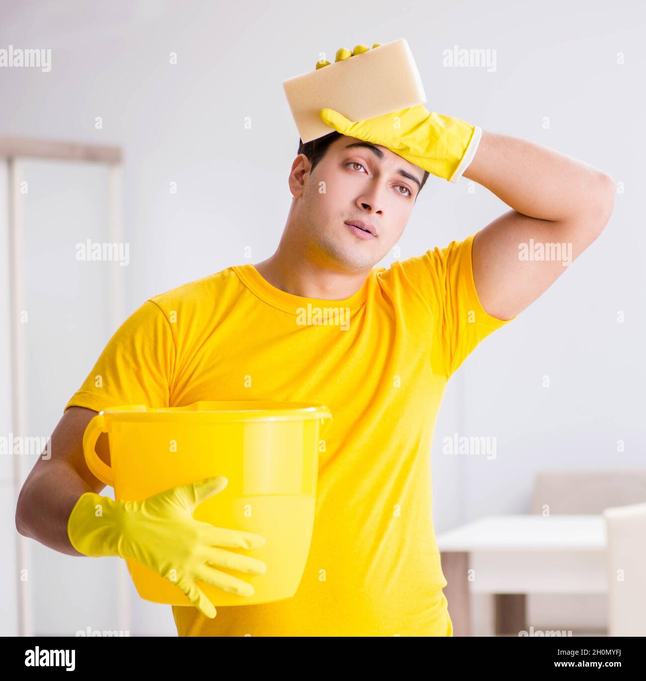 the-man-husband-cleaning-the-house-helping-his-wife-stock-photo-alamy