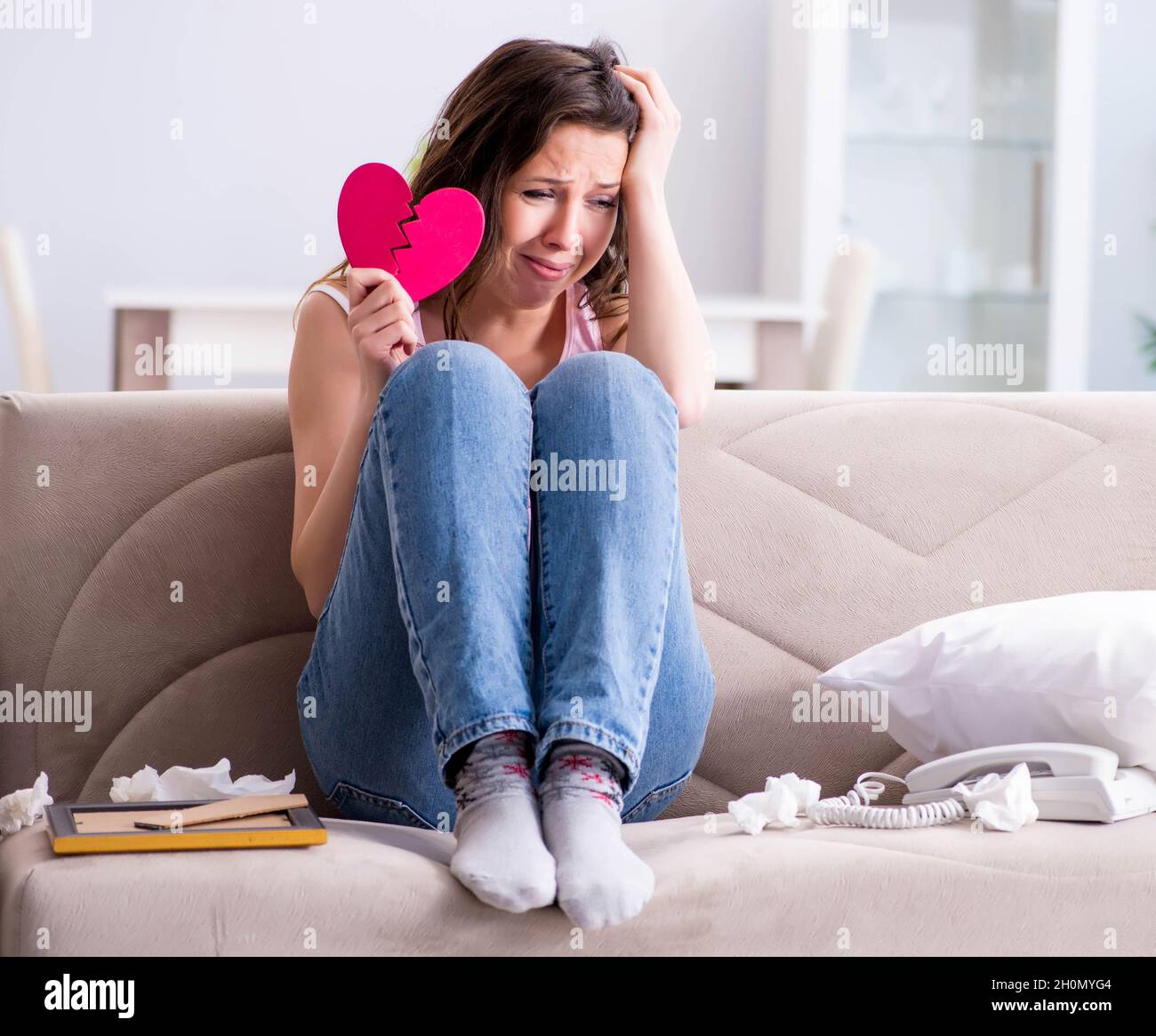 The broken woman heart in relationship concept Stock Photo - Alamy