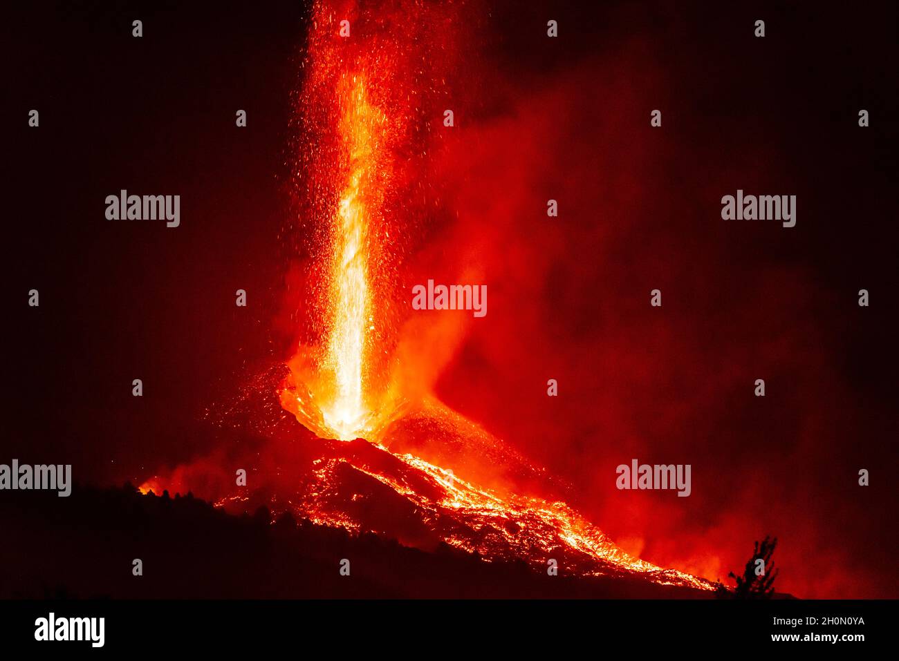 Lava fountains and multiple lava flows descend from the active crater during the volcano eruption on La Palma Island, Canary Islands, Spain, in Sep 21 Stock Photo