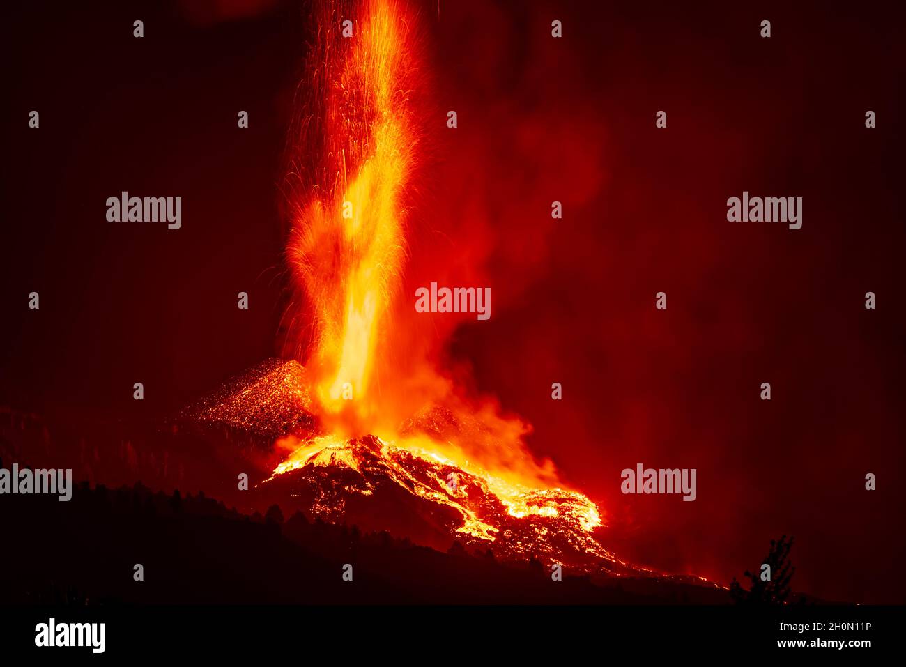 Lava fountains and multiple lava flows descend from the active crater during the volcano eruption on La Palma Island, Canary Islands, Spain, in Sep 21 Stock Photo