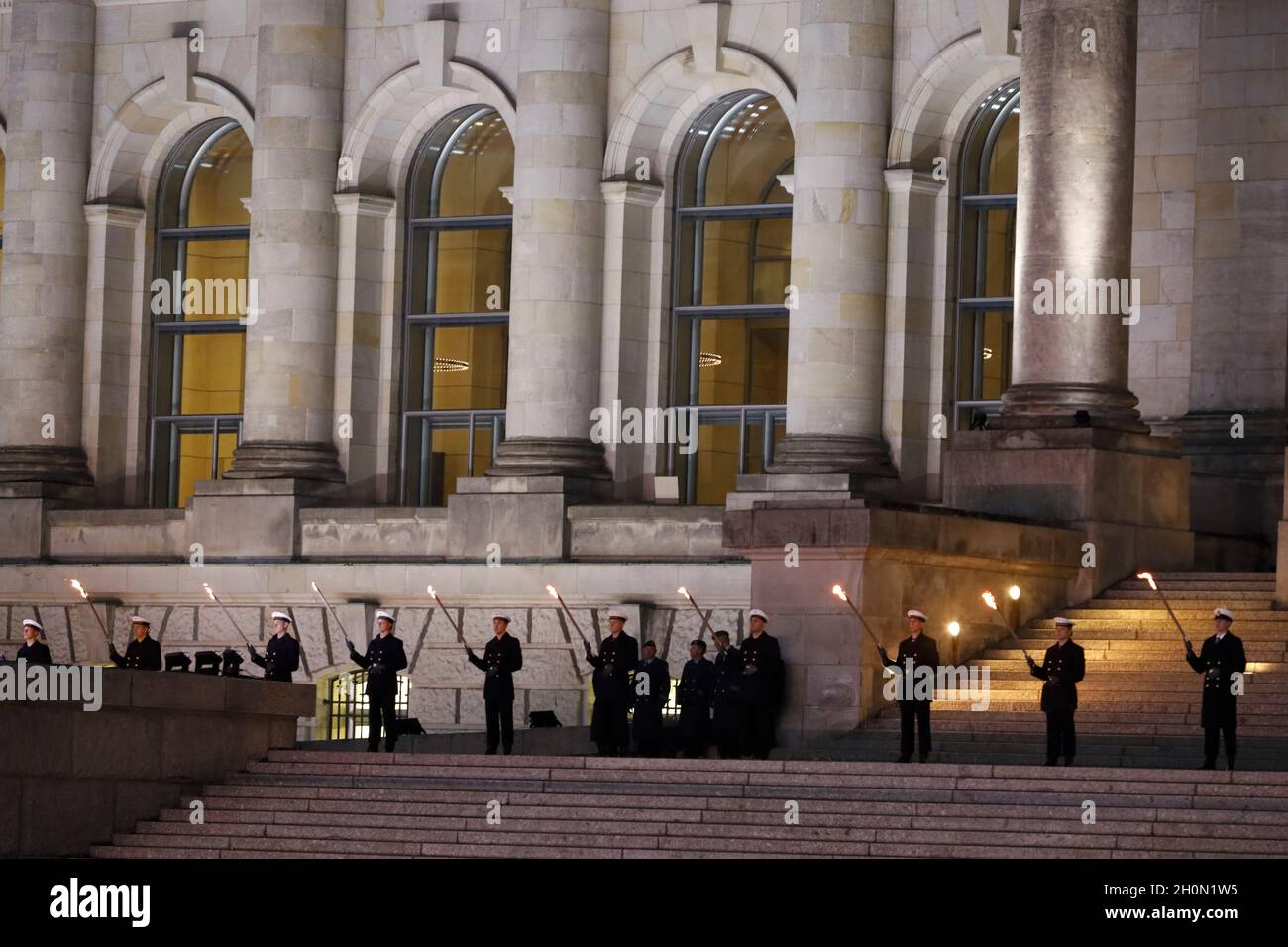 Berlin, Germany, 13th Oct, 2021.After almost twenty years, the Bundeswehr's mission in Afghanistan has finally come to an end as of August 27, 2021. The appreciation of the mission culminates with a Great Taps ceremony in front of the Reichstag in Berlin. The Great Taps is a solemn military ceremony held in the evening, performed by a special formation of military musicians, gunmen and torchbearers designated only for this purpose. Credit: Juergen Nowak / Alamy Live News. Stock Photo