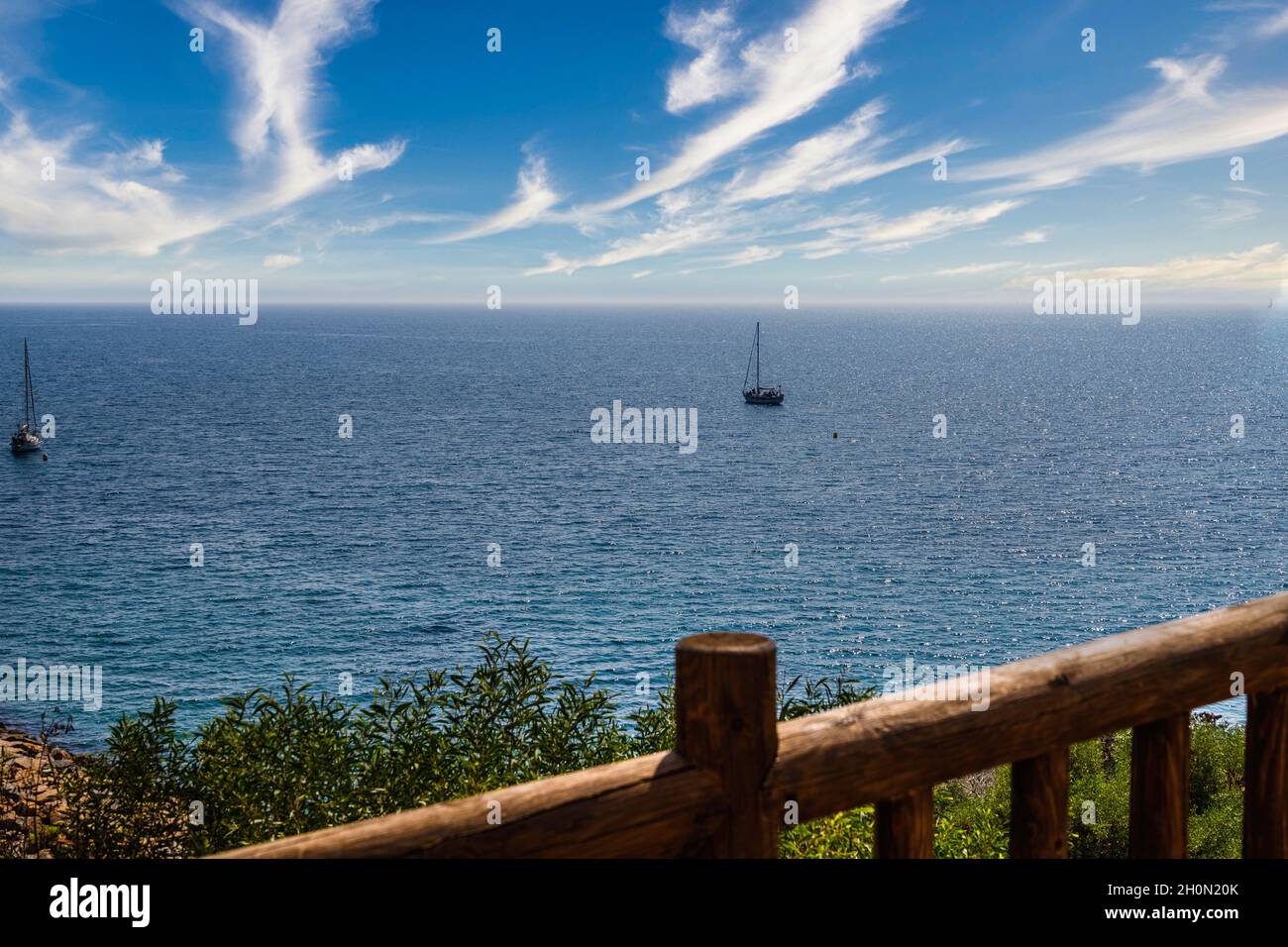 sailing boats on the seashore and clear blue sky Stock Photo - Alamy