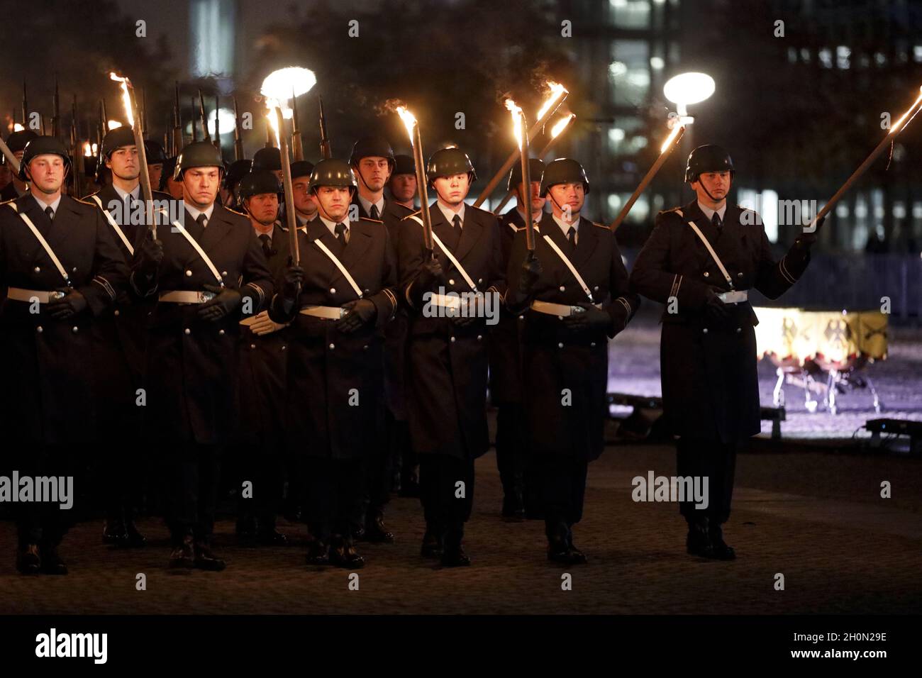 Berlin, Germany, 13th Oct, 2021.After almost twenty years, the Bundeswehr's mission in Afghanistan has finally come to an end as of August 27, 2021. The appreciation of the mission culminates with a Great Taps ceremony in front of the Reichstag in Berlin. The Great Taps is a solemn military ceremony held in the evening, performed by a special formation of military musicians, gunmen and torchbearers designated only for this purpose. Credit: Juergen Nowak / Alamy Live News. Stock Photo