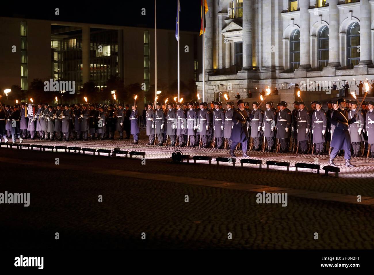 Berlin, Germany, 13th Oct, 2021.After almost twenty years, the Bundeswehr's mission in Afghanistan has finally come to an end as of August 27, 2021. The appreciation of the mission culminates with a Great Taps ceremony in front of the Reichstag in Berlin. The Great Taps is a solemn military ceremony held in the evening, performed by a special formation of military musicians, gunmen and torchbearers designated only for this purpose. Credit: Juergen Nowak / Alamy Live News. Stock Photo