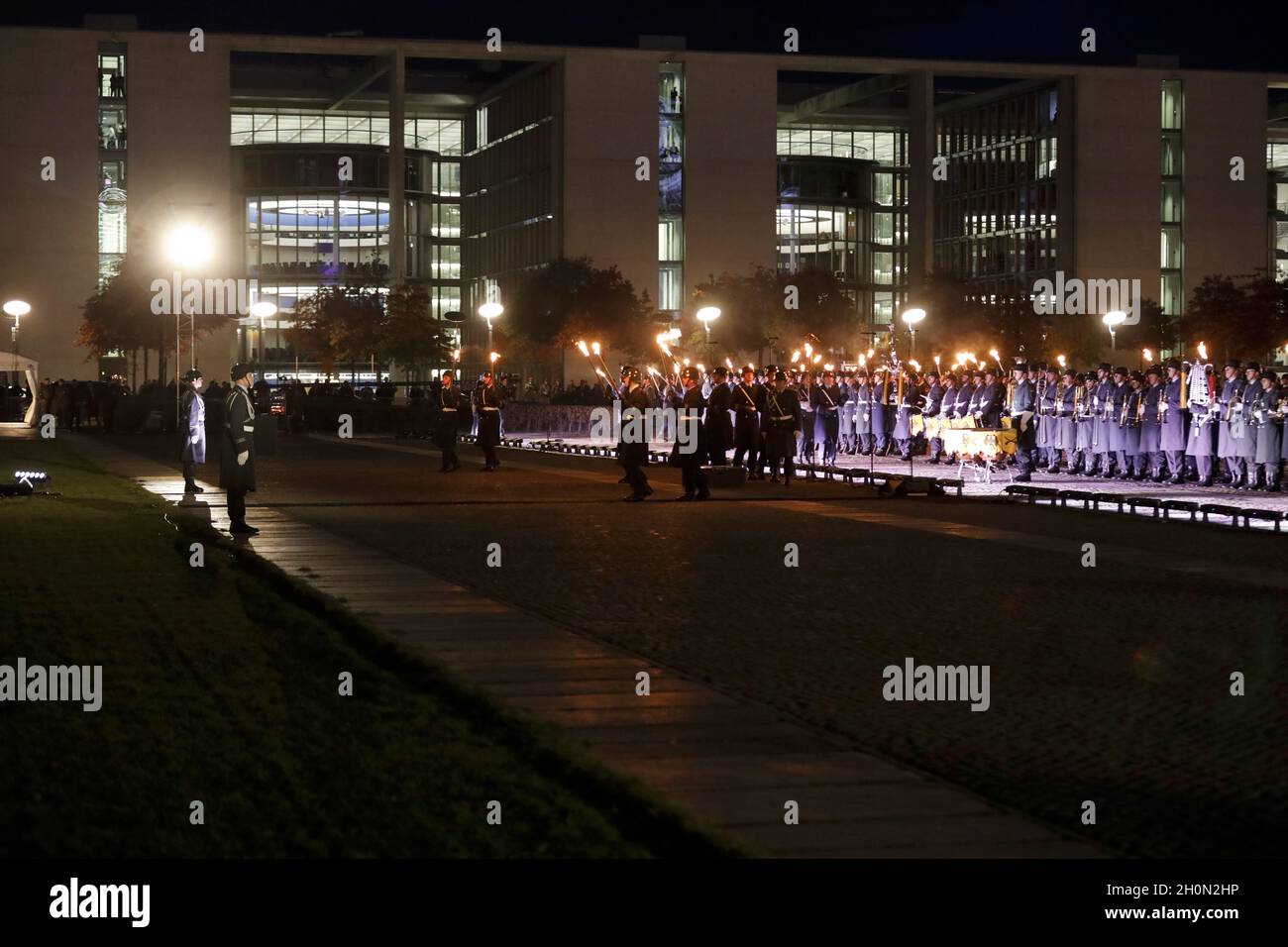 Berlin, Germany, 13th Oct, 2021.After almost twenty years, the Bundeswehr's mission in Afghanistan has finally come to an end as of August 27, 2021. The appreciation of the mission culminates with a Great Taps ceremony in front of the Reichstag in Berlin. The Great Taps is a solemn military ceremony held in the evening, performed by a special formation of military musicians, gunmen and torchbearers designated only for this purpose. Credit: Juergen Nowak / Alamy Live News. Stock Photo