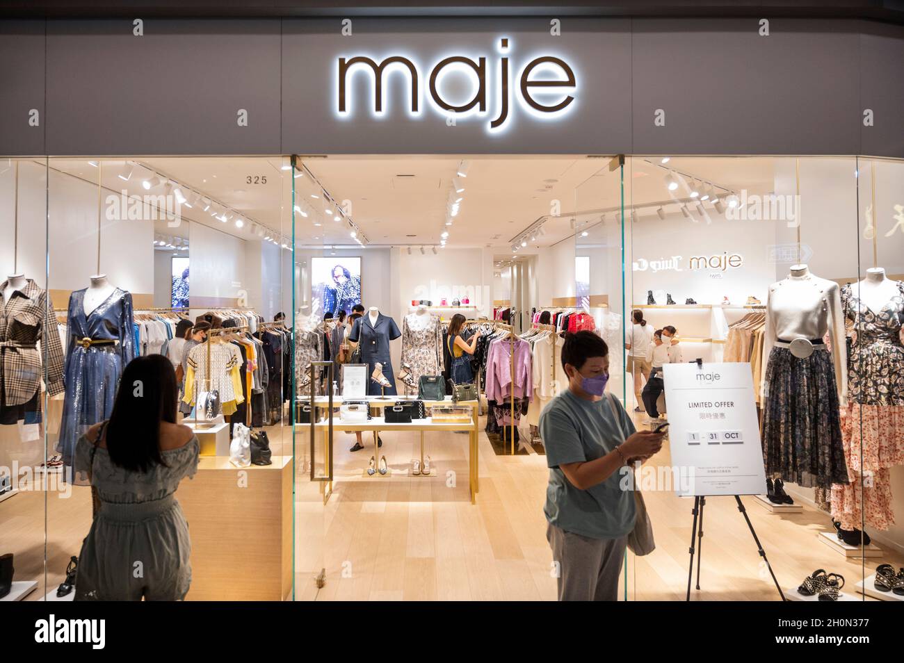 Shoppers are seen at the French fashion brand Maje store in Hong Kong's  Tung Chung district. (Photo by Budrul Chukrut / SOPA Images/Sipa USA Stock  Photo - Alamy