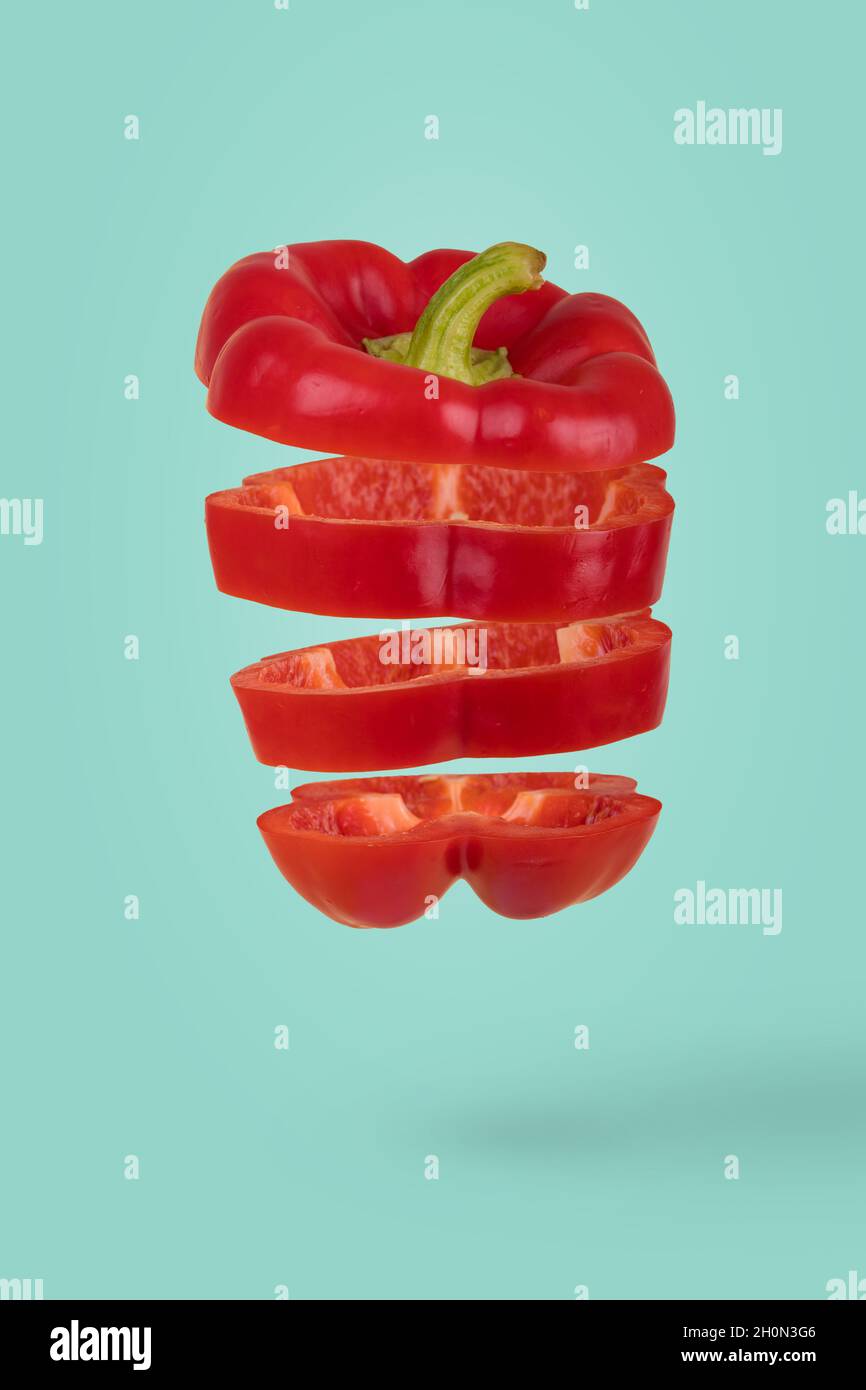 Minimal idea with Fresh ripe sliced bell pepper floating in air ...