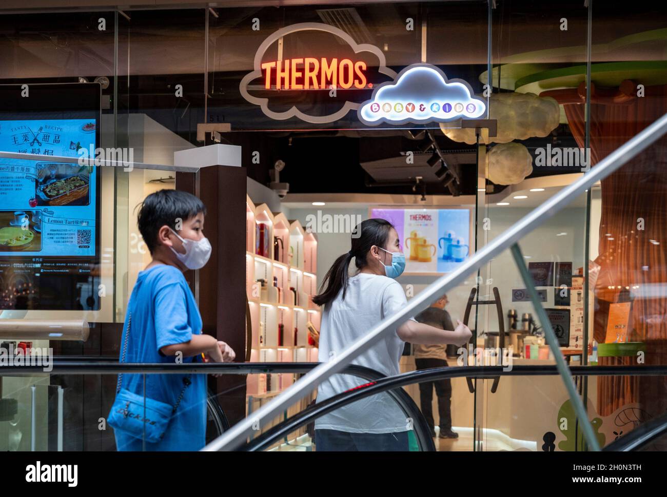 Shoppers walk past the German founded manufacturer of insulated food and  beverage containers and other consumer products, Thermos store in Hong  Kong's Tung Chung district. (Photo by Budrul Chukrut / SOPA Images/Sipa