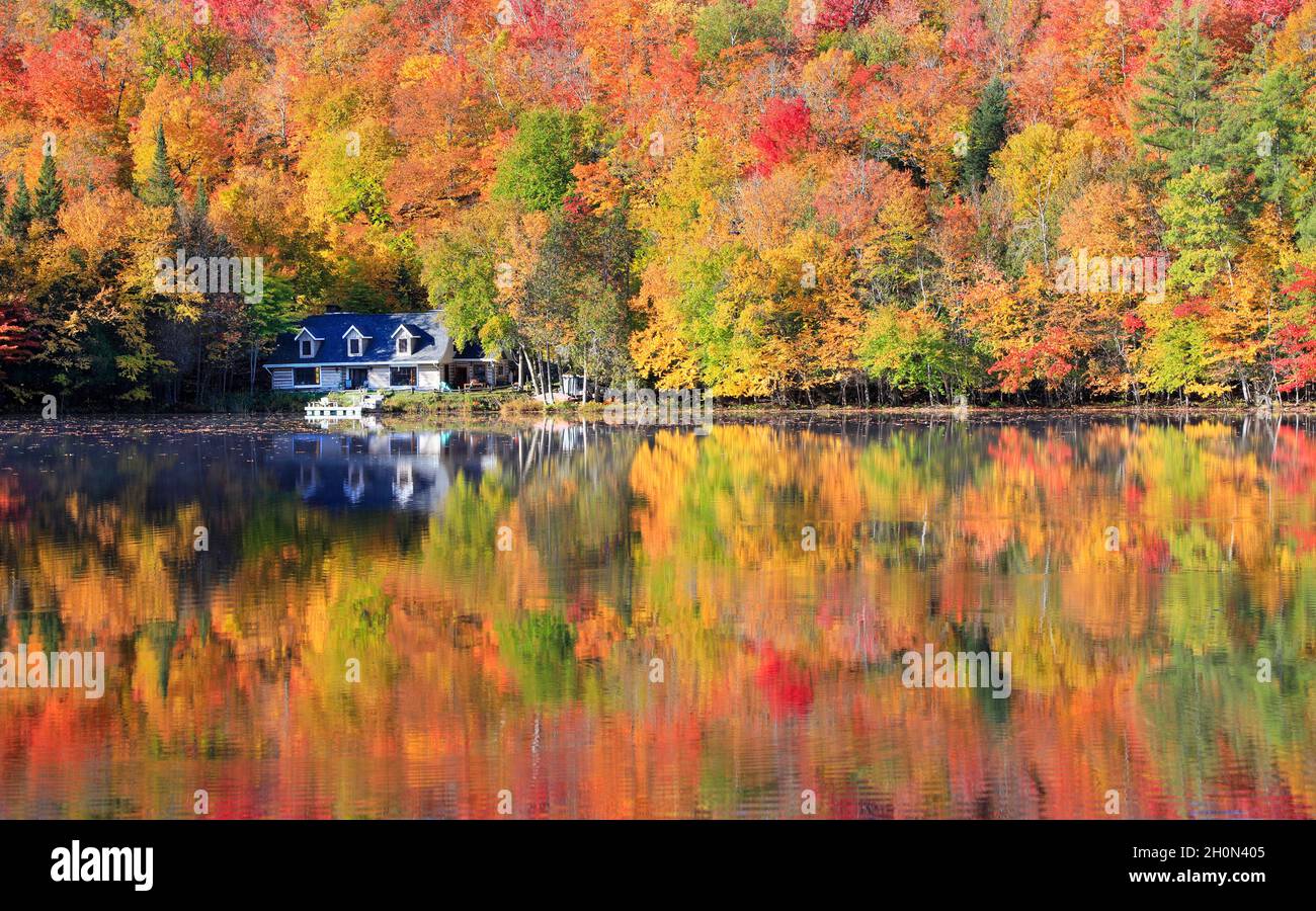 Autumn leaf color reflected on the lake in Mont Tremblant area, Quebec, Canada Stock Photo