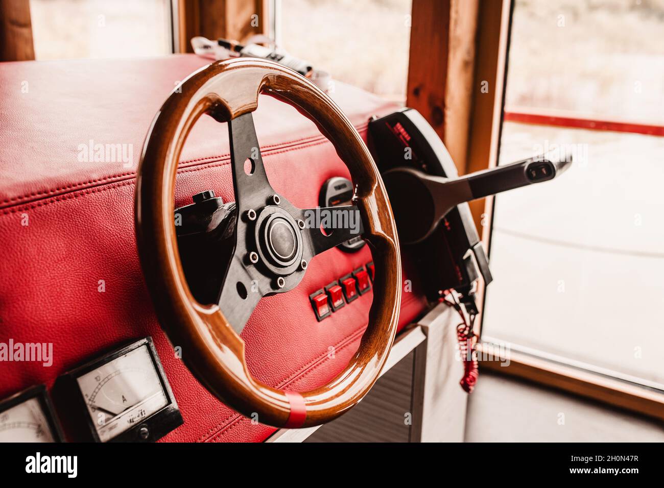 Steering wheel and boat controls - wood trim Stock Photo