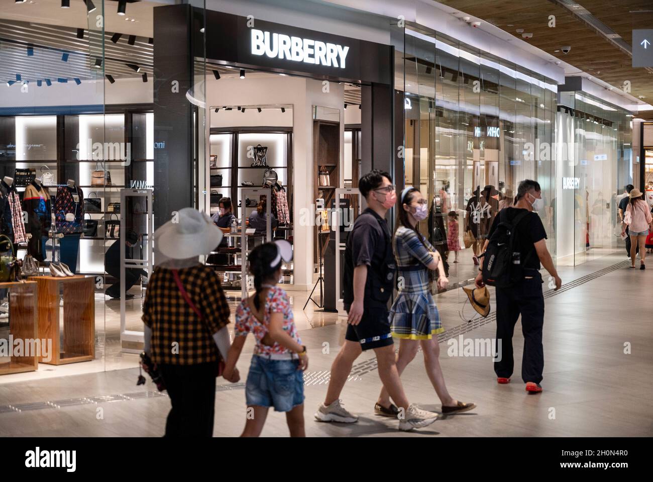 Hong Kong, China. 07th Oct, 2021. Shoppers walk past the British luxury  fashion brand Burberry store in Hong Kong's Tung Chung district. (Photo by  Budrul Chukrut/SOPA Images/Sipa USA) Credit: Sipa USA/Alamy Live