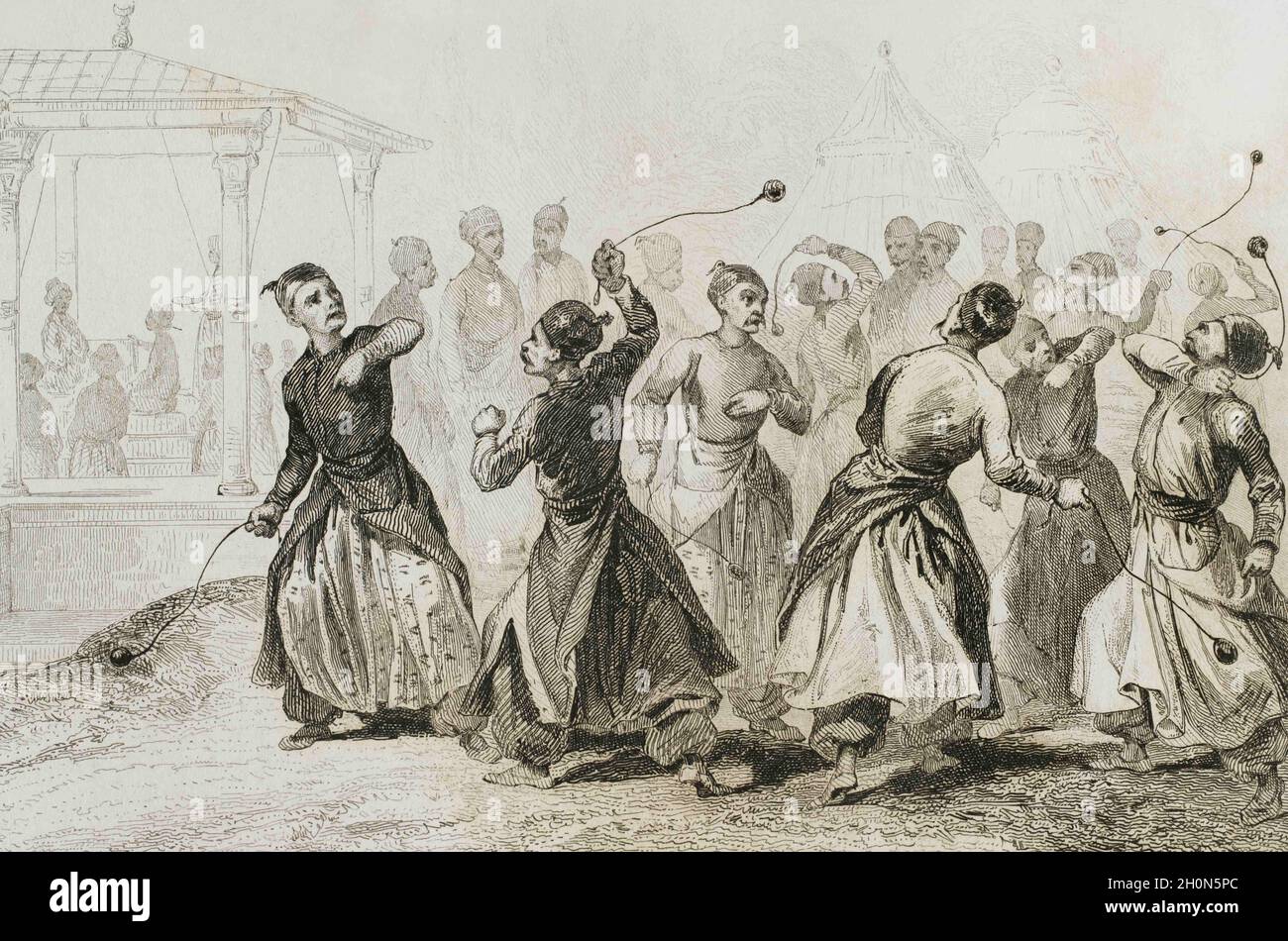 Ottoman Empire. Turkey. Men exercising in Tomak game. Martial art. Traditional game in which woll balls are used on leather straps. Engraving by Lemai Stock Photo