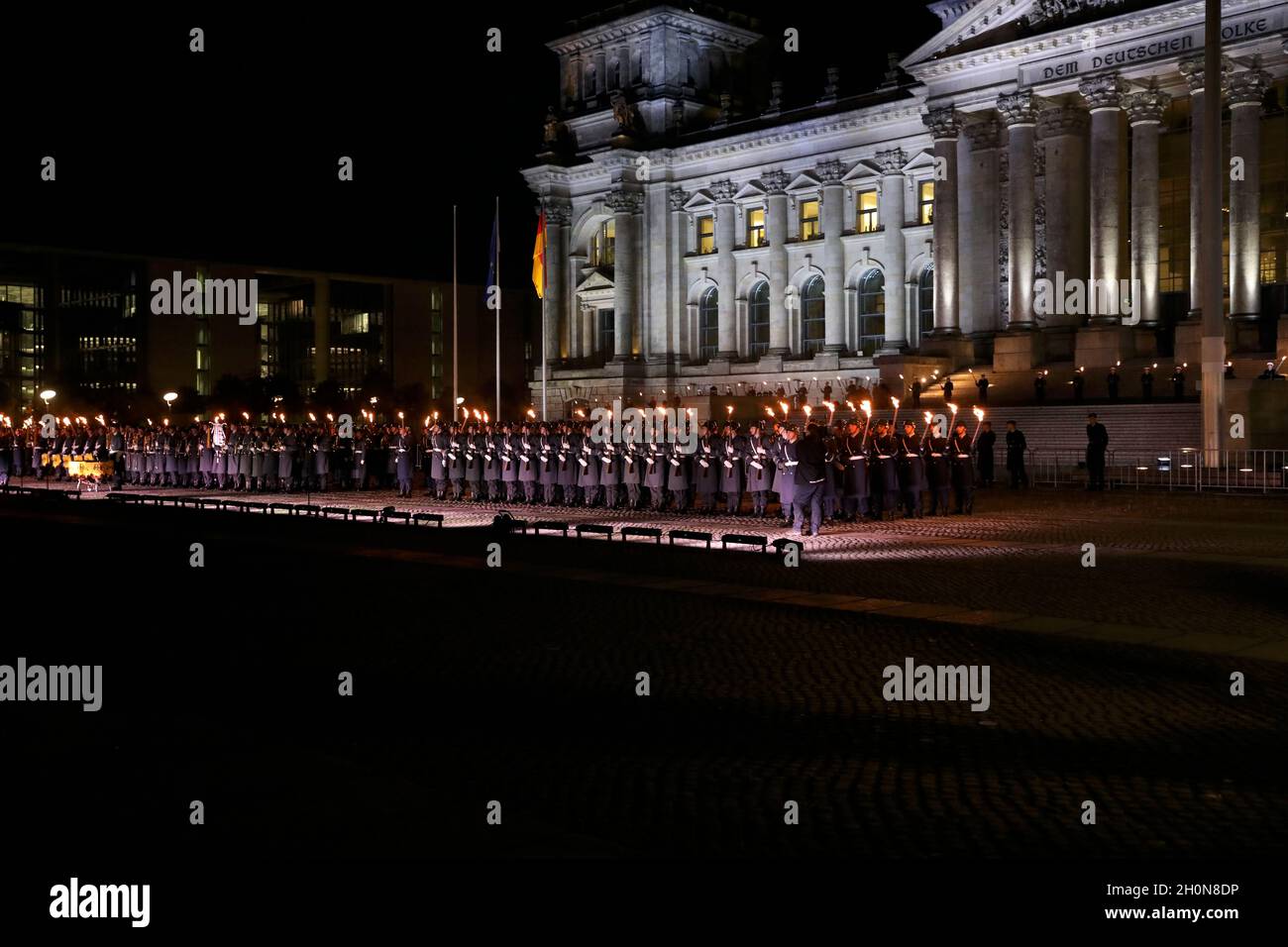Berlin, Germany, 13th Oct, 2021.After almost twenty years, the Bundeswehr's mission in Afghanistan has finally come to an end as of August 27, 2021. The appreciation of the mission culminates with a Great Taps ceremony in front of the Reichstag in Berlin. The Great Taps is a solemn military ceremony held in the evening, performed by a special formation of military musicians, gunmen and torchbearers designated only for this purpose. Credit: Juergen Nowak / Alamy Live News. Stock Photo