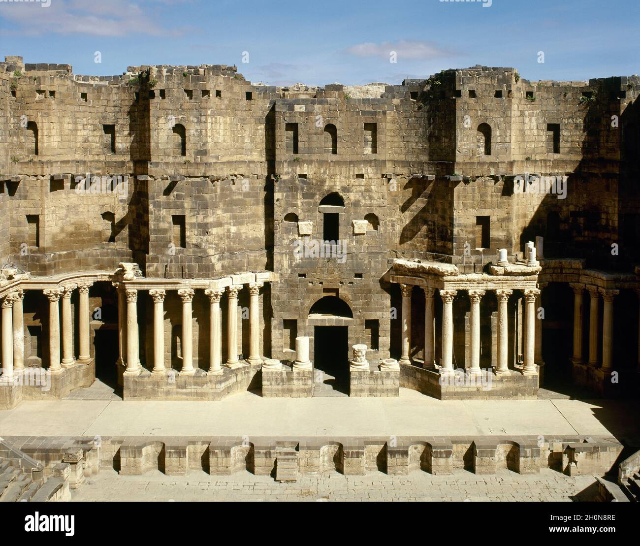 Syria. Bosra. Roman Theatre. Constructed using black basalt. 2nd century AD, during the reign of Trajan. View of the stage (Scaenae frons, porticus po Stock Photo