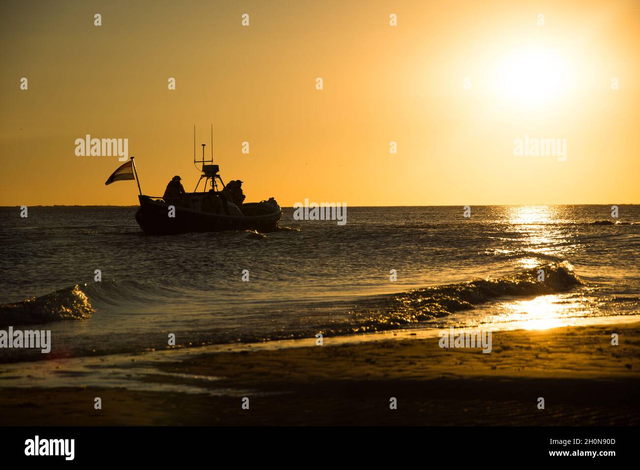 Silhouette of a ship on the sea on the sunset Stock Photo - Alamy