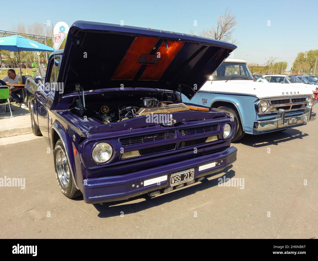 AVELLANEDA - BUENOS AIRES, ARGENTINA - Sep 27, 2021: open hood of a classic blue pickup Dodge D 100 showing the engine. Built by Chrysler in the 1970s Stock Photo