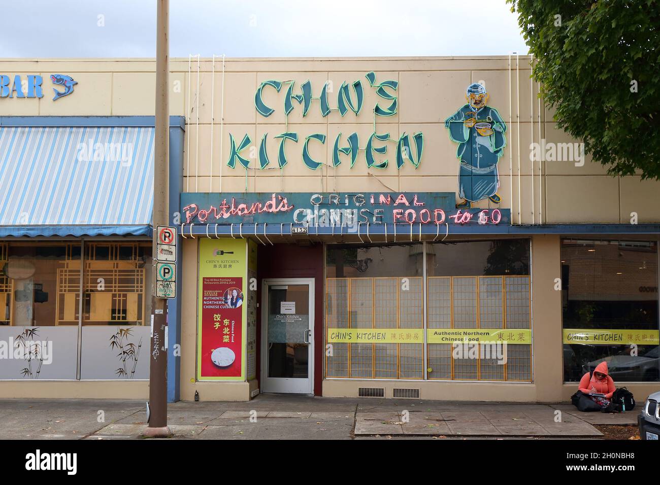 Chin's kitchen, 4126 NE Broadway, Portland, Oregon. exterior storefront and neon sign of a Chinese restaurant in the Hollywood neighborhood. Stock Photo