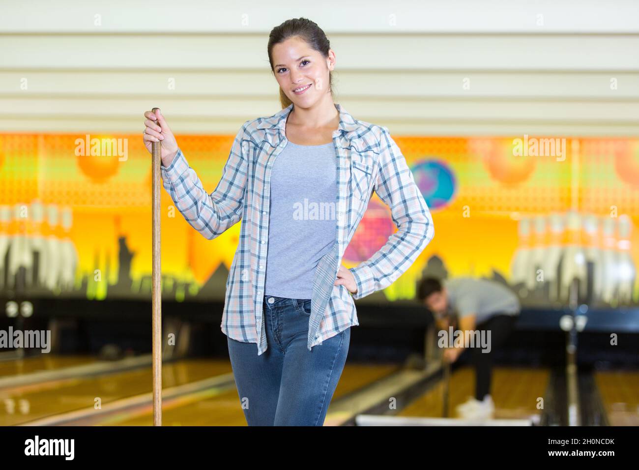 woman cleaning a bowling center Stock Photo